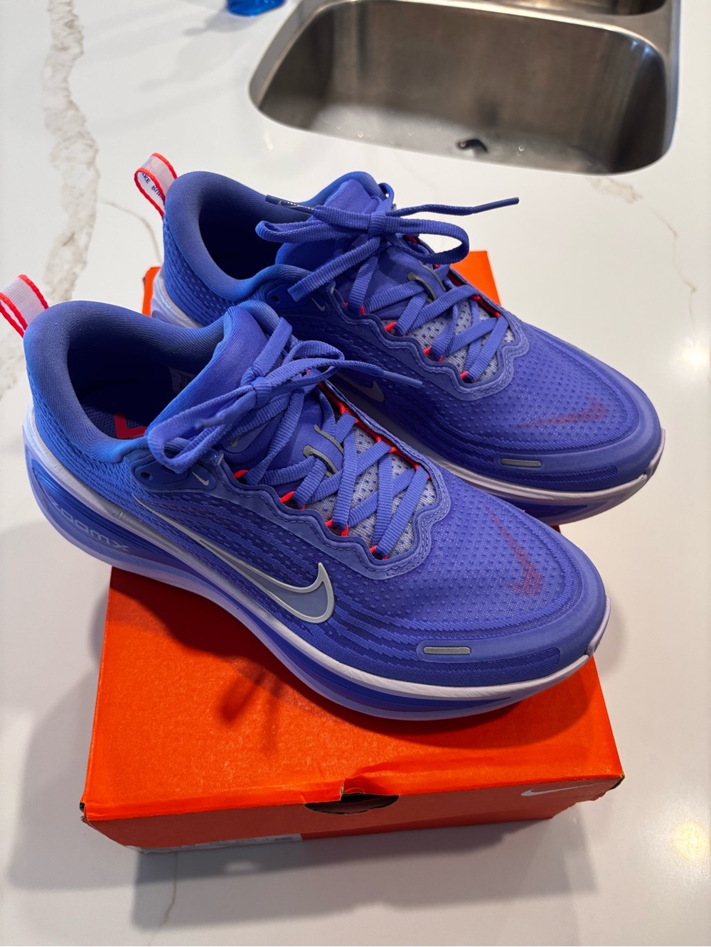 Nike Vomero 18 Women's Purple Athletic Running Shoes with orange accents